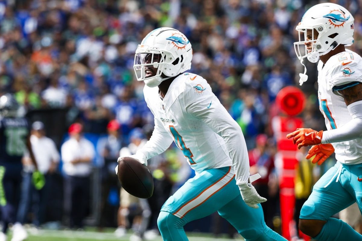 Sep 22, 2024; Seattle, Washington, USA; Miami Dolphins cornerback Kader Kohou (4) celebrates following an interception against the Seattle Seahawks during the first quarter at Lumen Field. Mandatory Credit: Joe Nicholson-Imagn Images