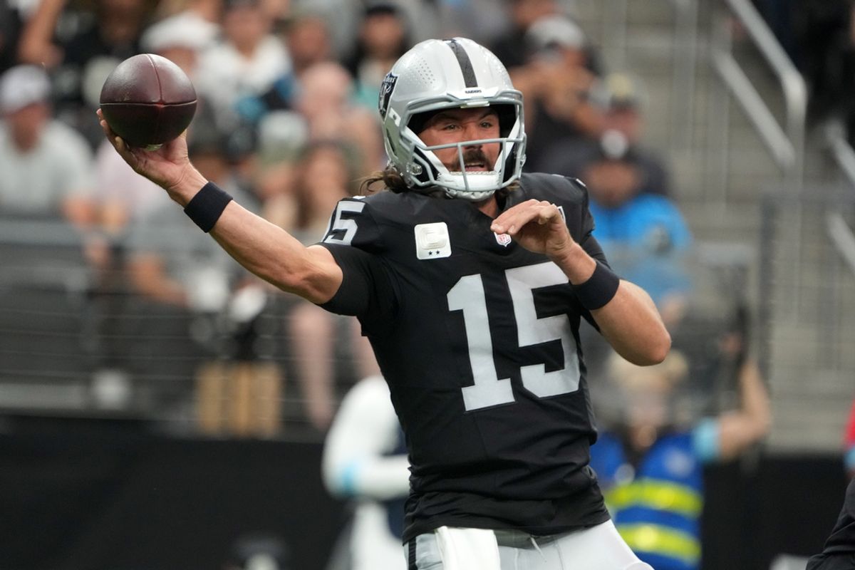 Sep 22, 2024; Paradise, Nevada, USA; Las Vegas Raiders quarterback Gardner Minshew (15) throws the ball against the Carolina Panthers in the first half at Allegiant Stadium. Mandatory Credit: Kirby Lee-Imagn Images
