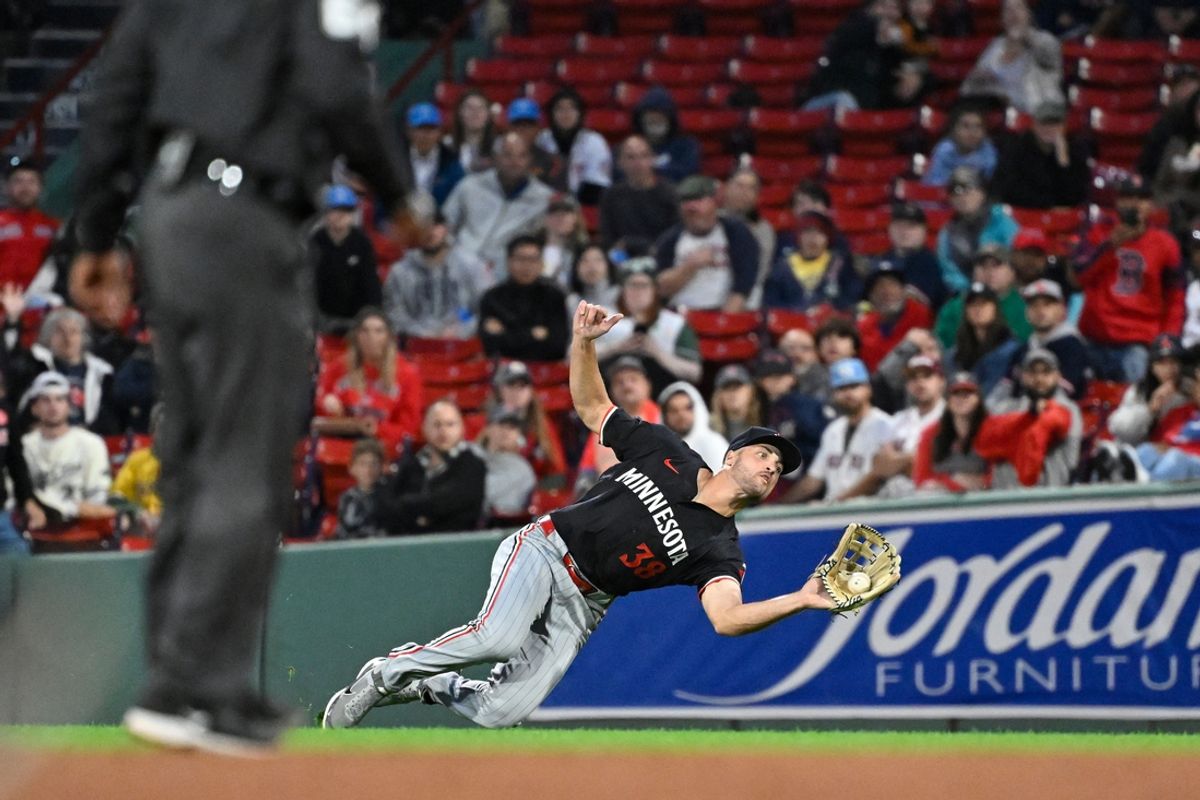 Sep 22, 2024; Boston, MA, USA;  Minnesota Twins right fielder Matt Wallner (38) makes a diving catch against the Boston Red Sox during the fifth inning at Fenway Park. Mandatory Credit: Eric Canha-Imagn Images