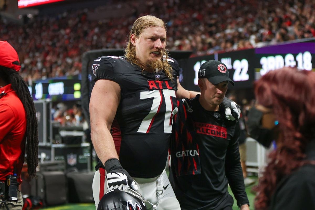 Sep 22, 2024; Atlanta, Georgia, USA; Atlanta Falcons offensive tackle Kaleb McGary (76) leaves the field with an injury against the Kansas City Chiefs in the second quarter at Mercedes-Benz Stadium. Mandatory Credit: Brett Davis-Imagn Images