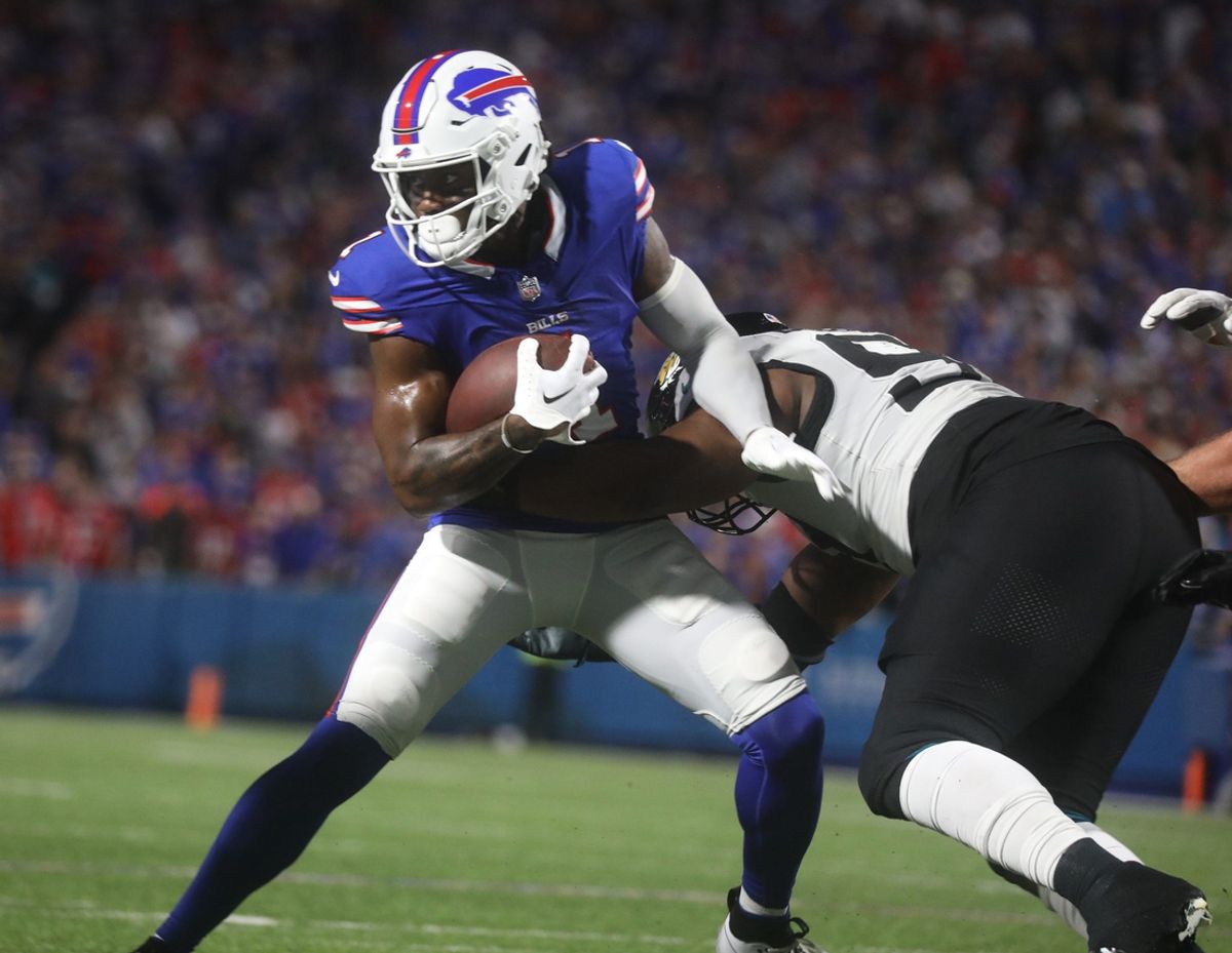 Bills Curstis Samuel runs with the ball and tries to shake off a Jaguars defensive player during first half action at Highmark Stadium in Orchard Park on Sept. 23, 2024.
