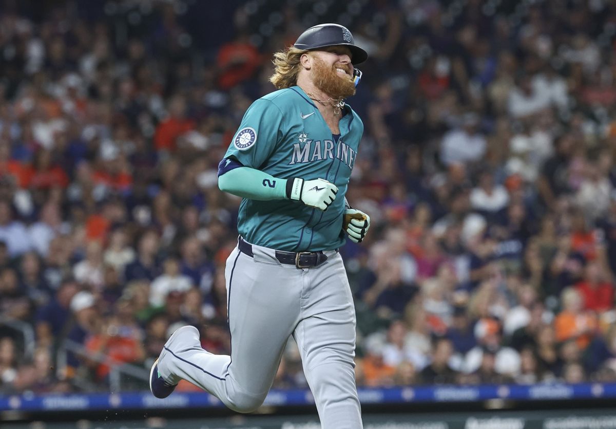 Sep 23, 2024; Houston, Texas, USA; Seattle Mariners designated hitter Justin Turner (2) runs to first base after hitting a single during the seventh inning against the Houston Astros at Minute Maid Park. Mandatory Credit: Troy Taormina-Imagn Images