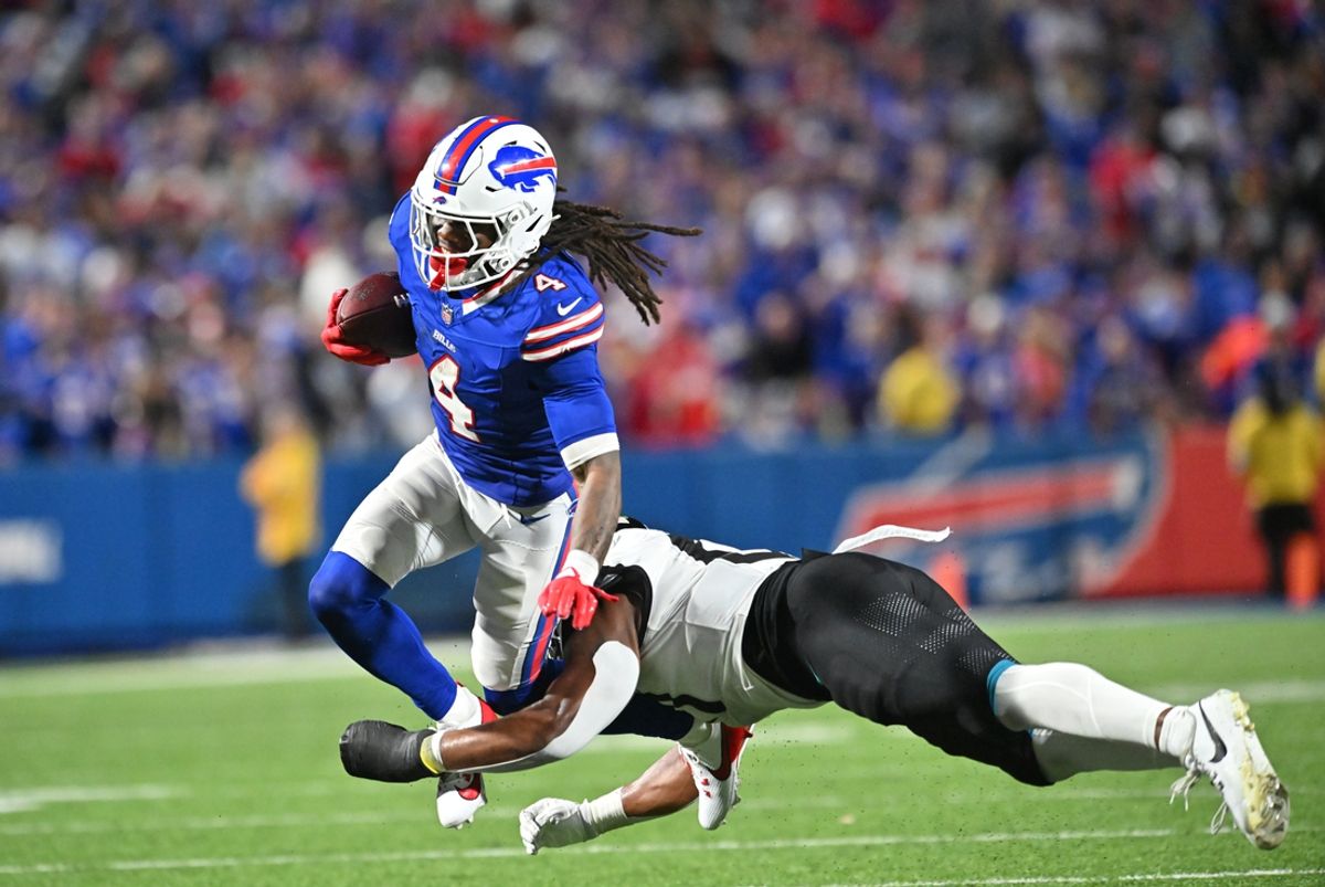 Sep 23, 2024; Orchard Park, New York, USA; Buffalo Bills running back James Cook (4) is tackled by Jacksonville Jaguars linebacker Ventrell Miller (51) in the third quarter at Highmark Stadium. Mandatory Credit: Mark Konezny-Imagn Images