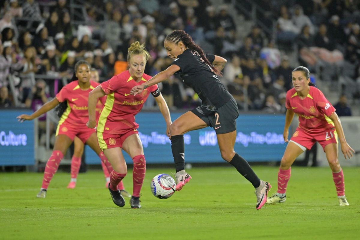 Sep 23, 2024; Los Angeles, California, USA; Angel City FC forward Sydney Leroux (2) controls the ball against Portland Thorns FC defender Becky Sauerbrunn (4) during the second half at BMO Stadium. Mandatory Credit: Jayne Kamin-Oncea-Imagn Images