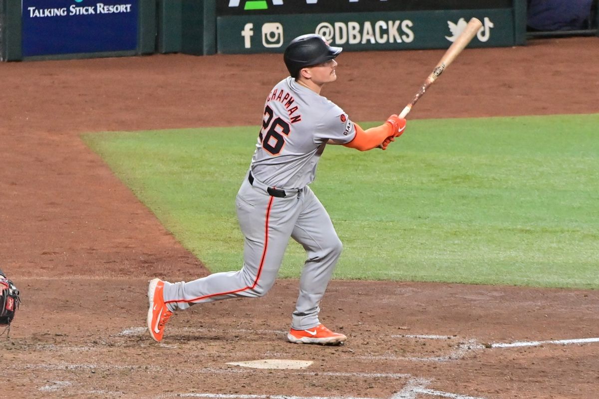 Sep 23, 2024; Phoenix, Arizona, USA;  San Francisco Giants third base Matt Chapman (26) hits a RBI triple in the seventh inning against the Arizona Diamondbacks at Chase Field. Mandatory Credit: Matt Kartozian-Imagn Images