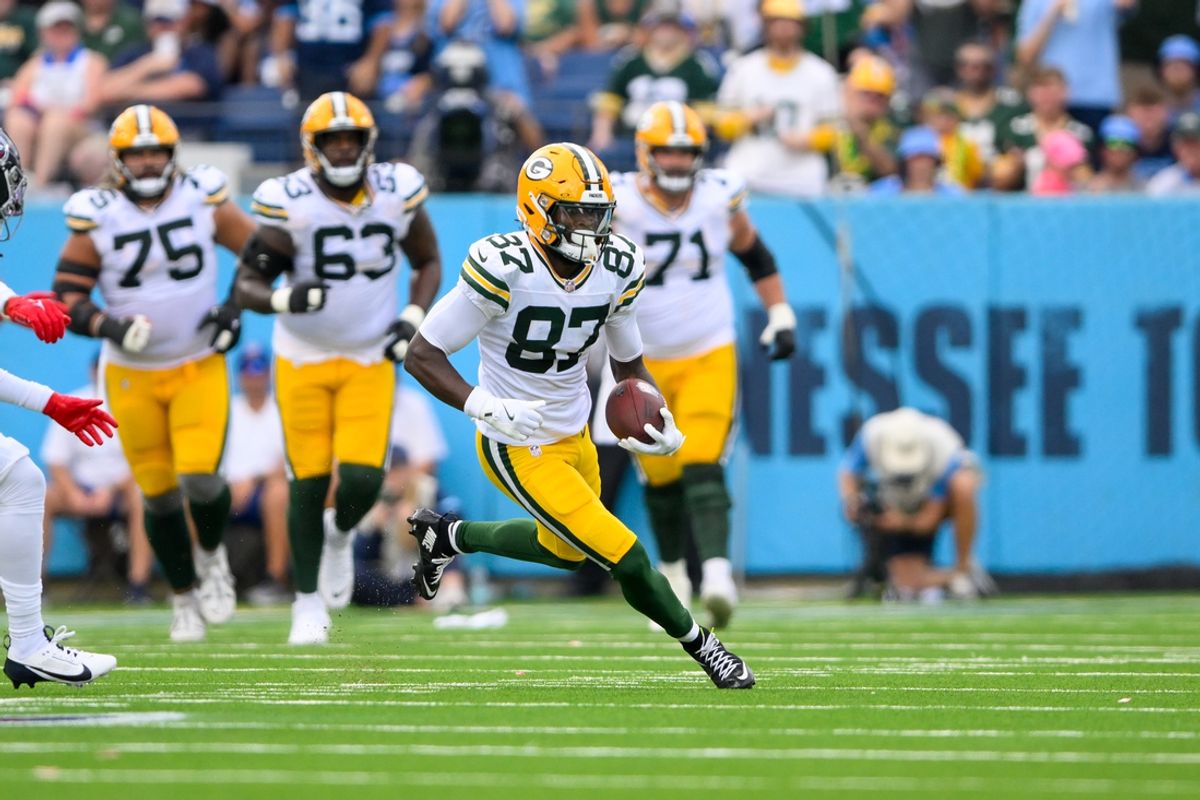 Sep 22, 2024; Nashville, Tennessee, USA;  Green Bay Packers wide receiver Romeo Doubs (87) makes a catch and runs the ball against the Tennessee Titans during the first half at Nissan Stadium. Mandatory Credit: Steve Roberts-Imagn Images