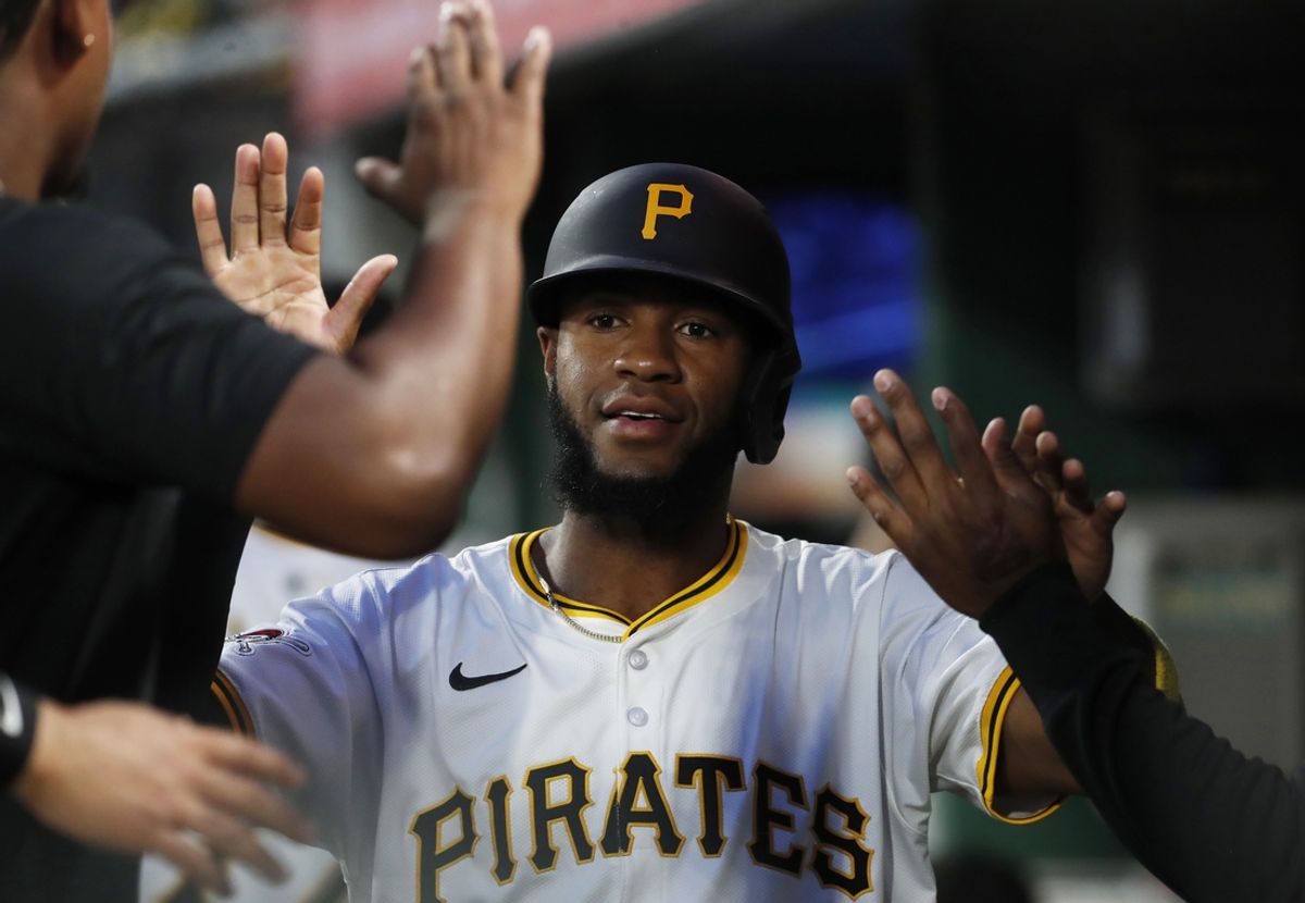 Sep 24, 2024; Pittsburgh, Pennsylvania, USA; Pittsburgh Pirates right fielder Bryan De La Cruz (41) celebrates with teammates in the dugout after scoring a run against the Milwaukee Brewers  during the second inning at PNC Park. Mandatory Credit: Charles LeClaire-Imagn Images