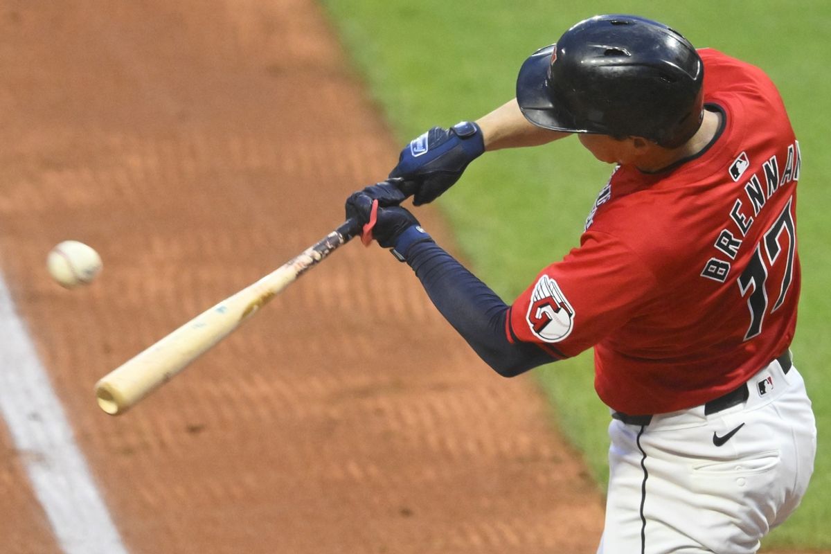 Sep 24, 2024; Cleveland, Ohio, USA; Cleveland Guardians right fielder Will Brennan (17) singles in the second inning against the Cincinnati Reds at Progressive Field. Mandatory Credit: David Richard-Imagn Images