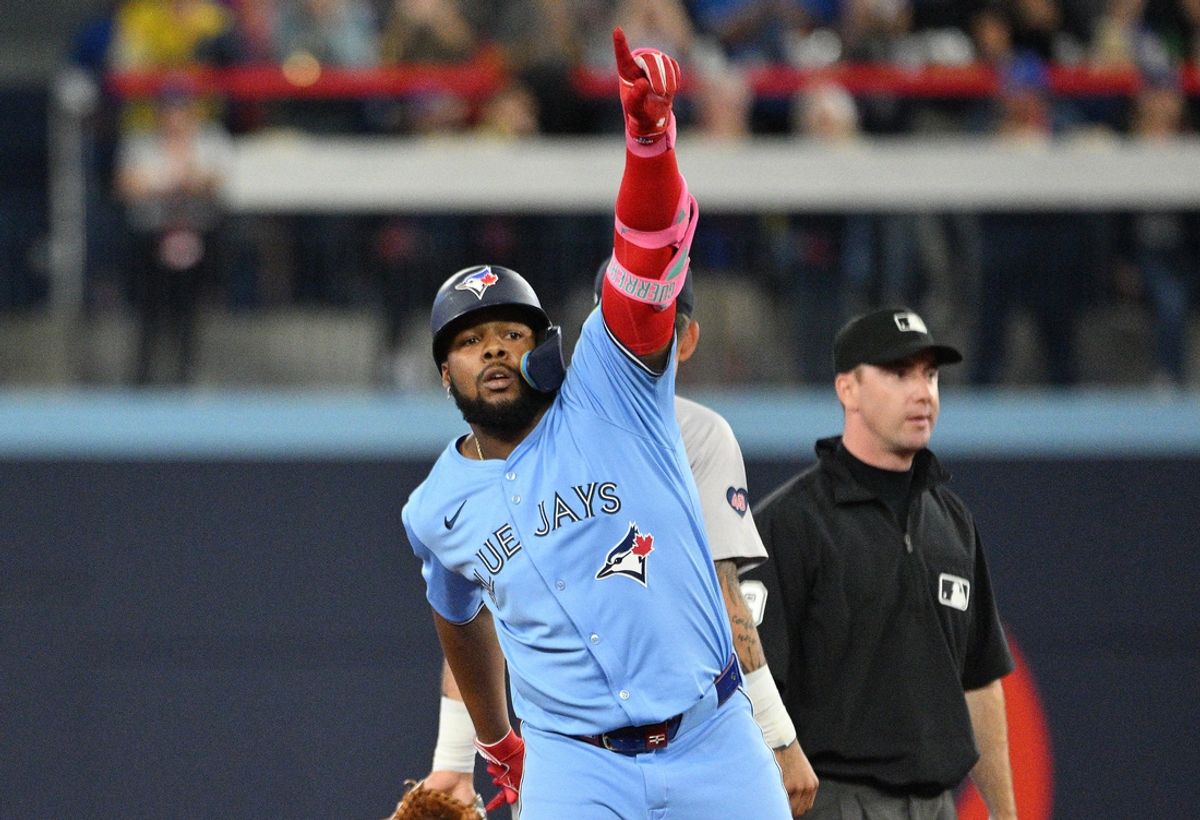 Sep 24, 2024; Toronto, Ontario, CAN; Toronto Blue Jays designated hitter Vladimir Guerrero Jr. (27) reacts after hitting a two run RBI double against the Boston Red Sox in the third inning at Rogers Centre. Mandatory Credit: Dan Hamilton-Imagn Images