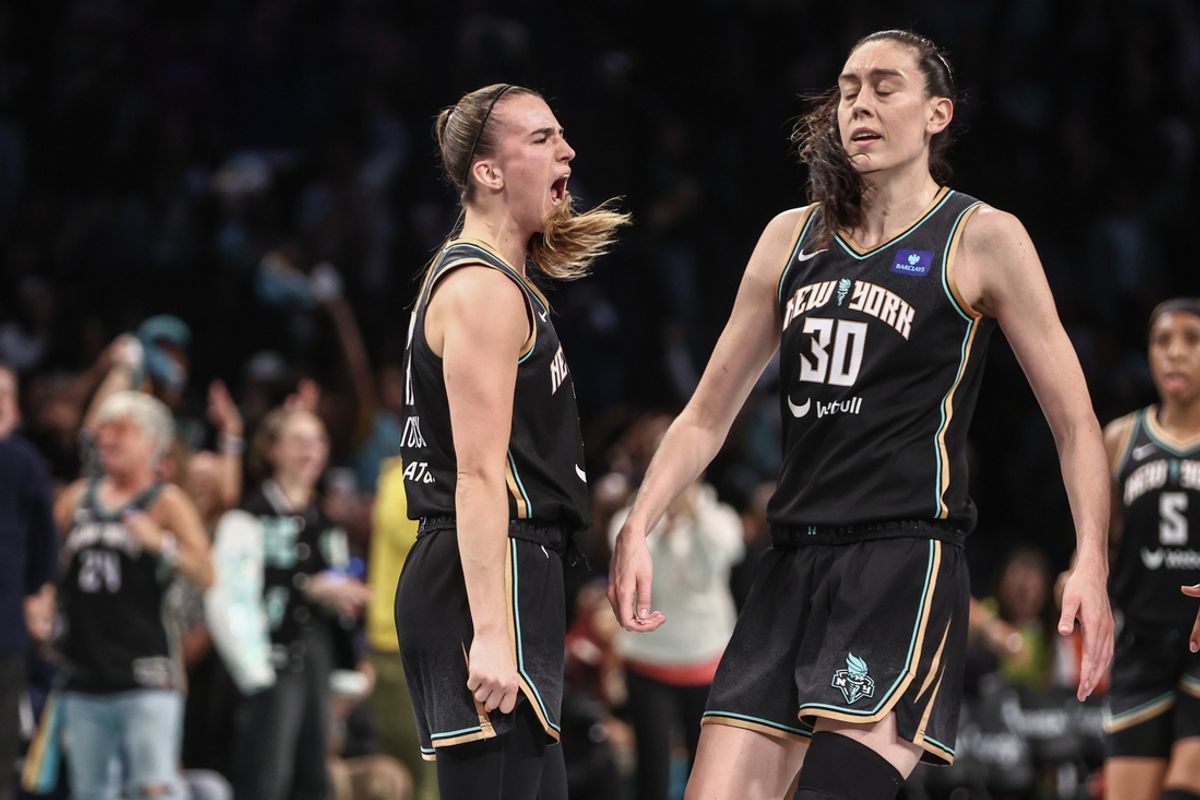Sep 24, 2024; Brooklyn, New York, USA; New York Liberty guard Sabrina Ionescu (20) celebrates with forward Breanna Stewart (30) during game two of the first round of the 2024 WNBA Playoffs against the Atlanta Dream at Barclays Center. Mandatory Credit: Wendell Cruz-Imagn Images