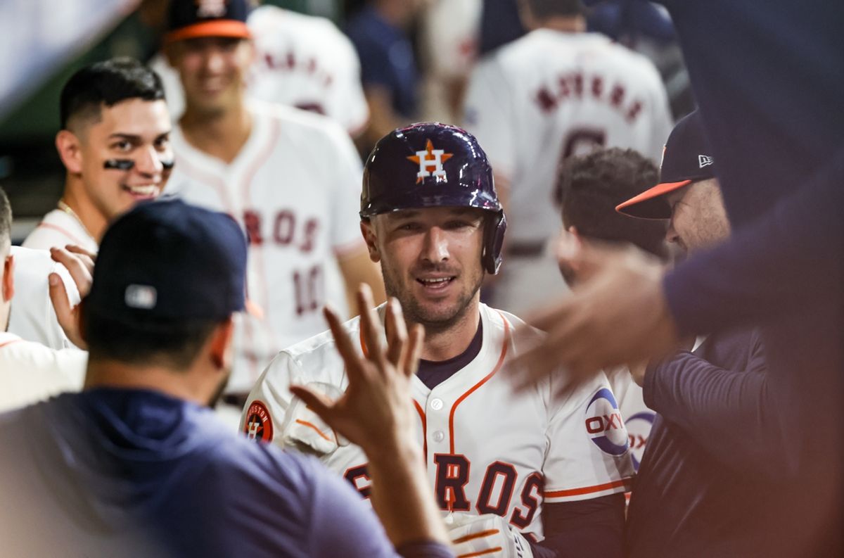 Sep 24, 2024; Houston, Texas, USA; Houston Astros third baseman Alex Bregman (2) celebrates his home run with teammates in the dugout against Seattle Mariners starting pitcher Logan Gilbert (36) (not pictured) in the first inning at Minute Maid Park. Mandatory Credit: Thomas Shea-Imagn Images