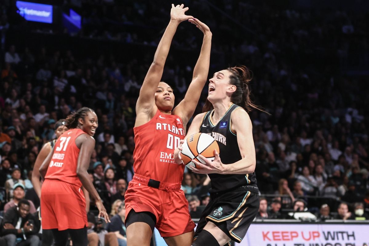 Sep 24, 2024; Brooklyn, New York, USA; New York Liberty forward Breanna Stewart (30) looks to drive past Atlanta Dream forward Naz Hillmon (00) during game two of the first round of the 2024 WNBA Playoffs at Barclays Center. Mandatory Credit: Wendell Cruz-Imagn Images