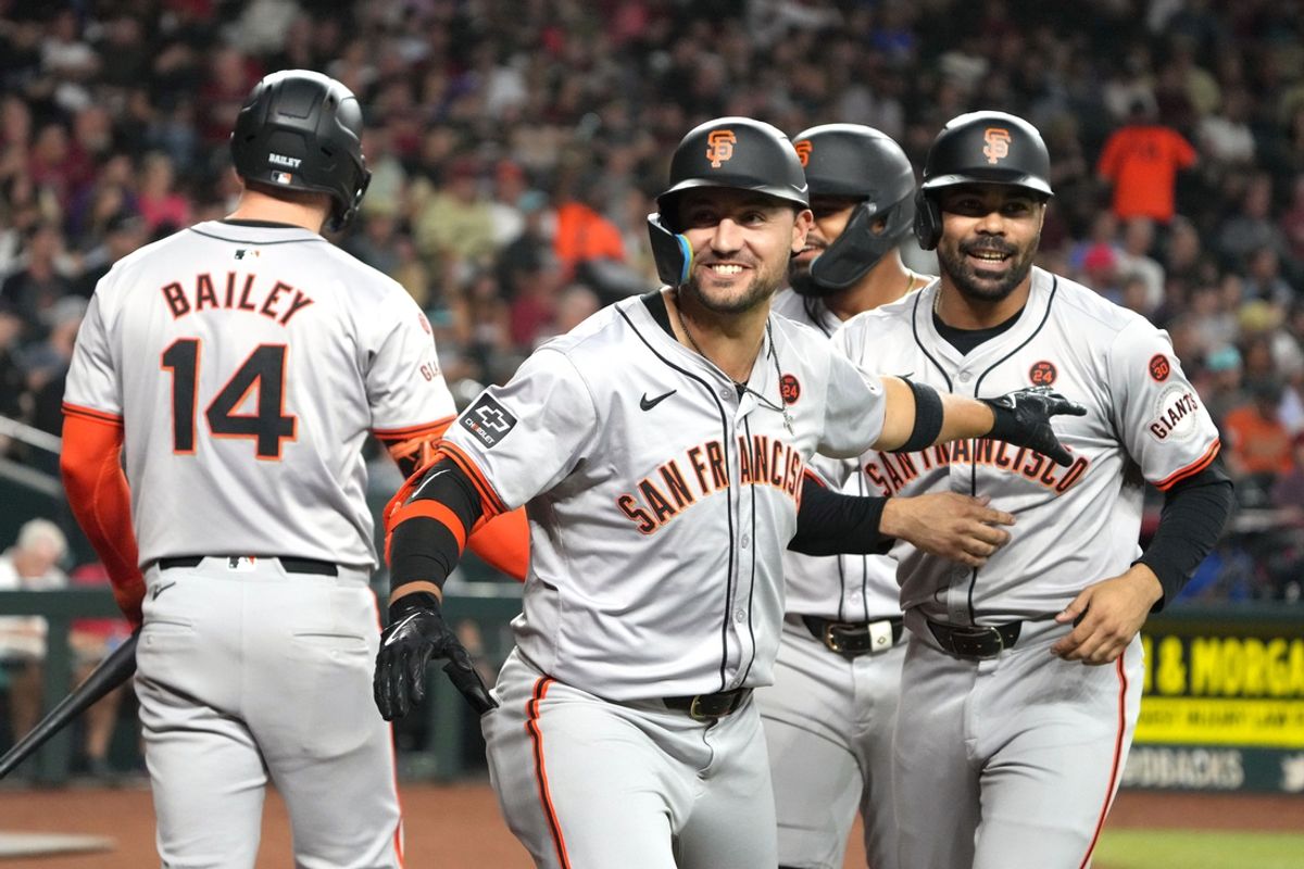 Sep 24, 2024; Phoenix, Arizona, USA; San Francisco Giants outfielder Michael Conforto (8) celebrates with catcher Patrick Bailey (14) and first base LaMonte Wade Jr. (31) after hitting a three-run home run against the Arizona Diamondbacks in the third inning at Chase Field. Mandatory Credit: Rick Scuteri-Imagn Images