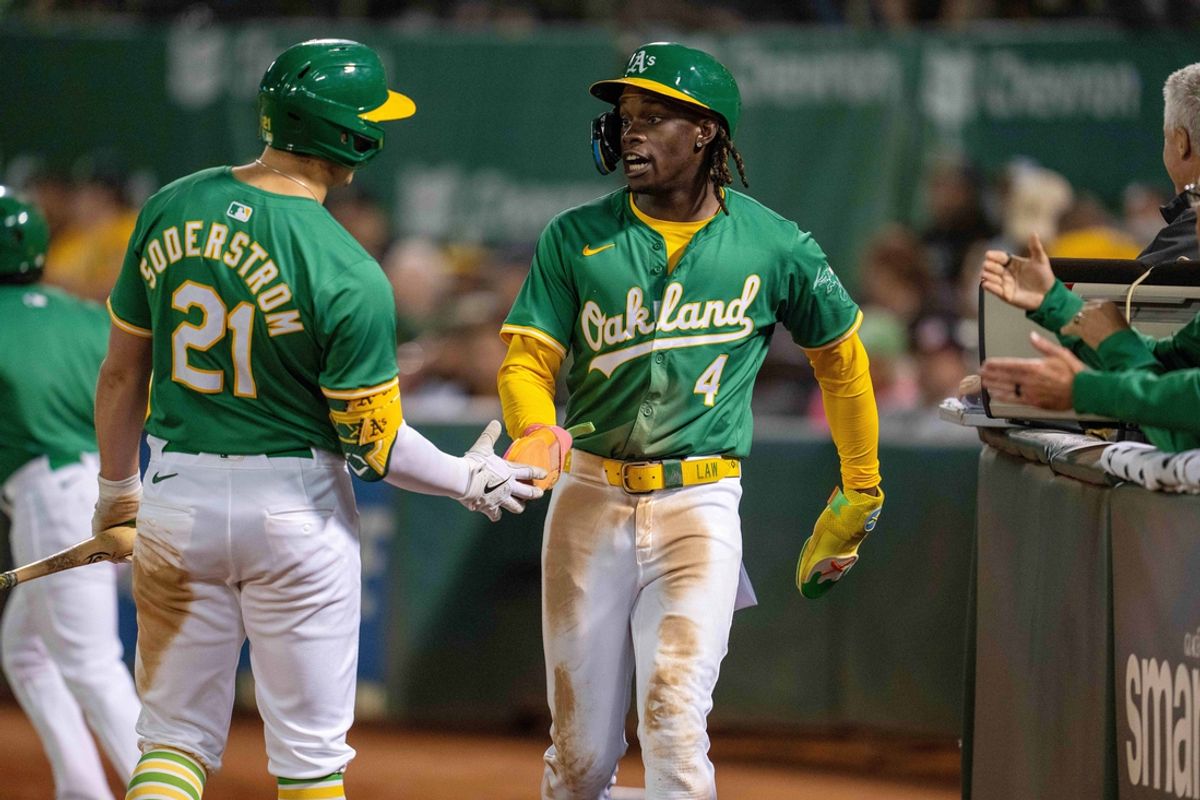 Sep 24, 2024; Oakland, California, USA; Oakland Athletics right fielder Lawrence Butler (4) celebrates with first baseman Tyler Soderstrom (21) after scoring against the Texas Rangers during the third inning at Oakland-Alameda County Coliseum. Mandatory Credit: Neville E. Guard-Imagn Images