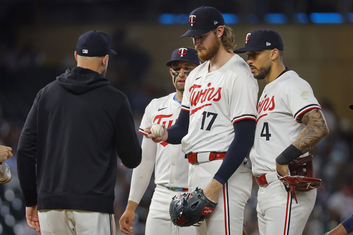 Sep 24, 2024; Minneapolis, Minnesota, USA; Minnesota Twins starting pitcher Bailey Ober (17) gives the ball to manager Rocco Baldelli after pitching to the Miami Marlins as third baseman Royce Lewis (23) and Carlos Correa (4) look on in the sixth inning at Target Field. Mandatory Credit: Bruce Kluckhohn-Imagn Images