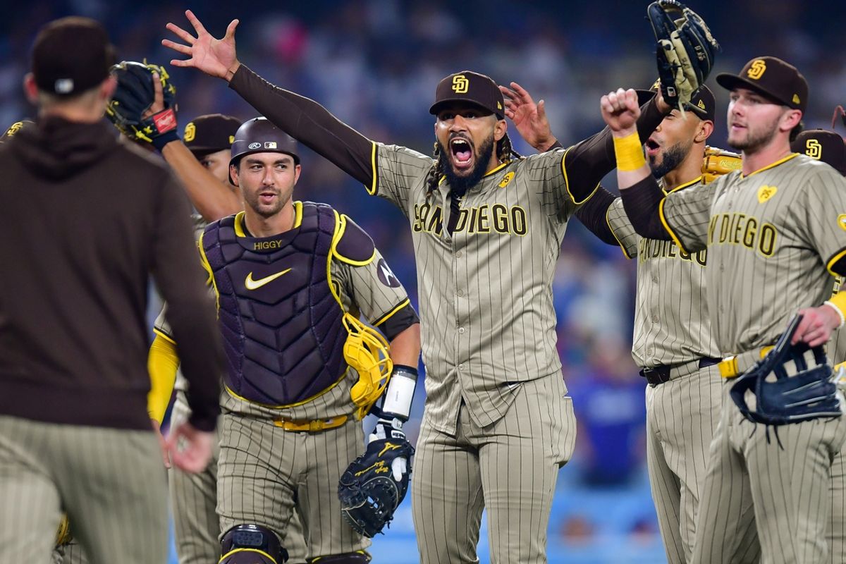 Sep 24, 2024; Los Angeles, California, USA; San Diego Padres and right fielder Fernando Tatis Jr. (23) celebrate the victory against the Los Angeles Dodgers and postseason berth at Dodger Stadium. Mandatory Credit: Gary A. Vasquez-Imagn Images