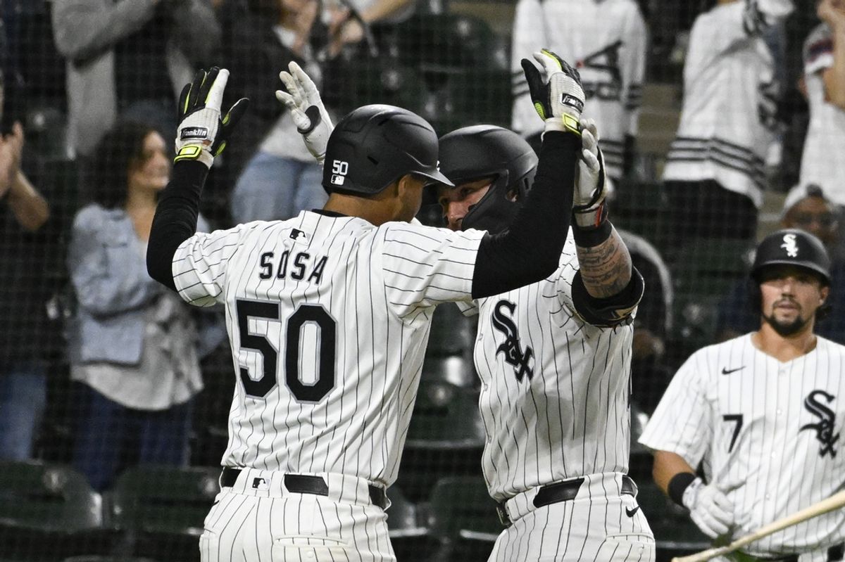 Sep 25, 2024; Chicago, Illinois, USA;  Chicago White Sox catcher Korey Lee (26) high fives Chicago White Sox third baseman Lenyn Sosa (50) after they score on Lee’s two-run home run against the Los Angeles Angels during the second inning at Guaranteed Rate Field. Mandatory Credit: Matt Marton-Imagn Images