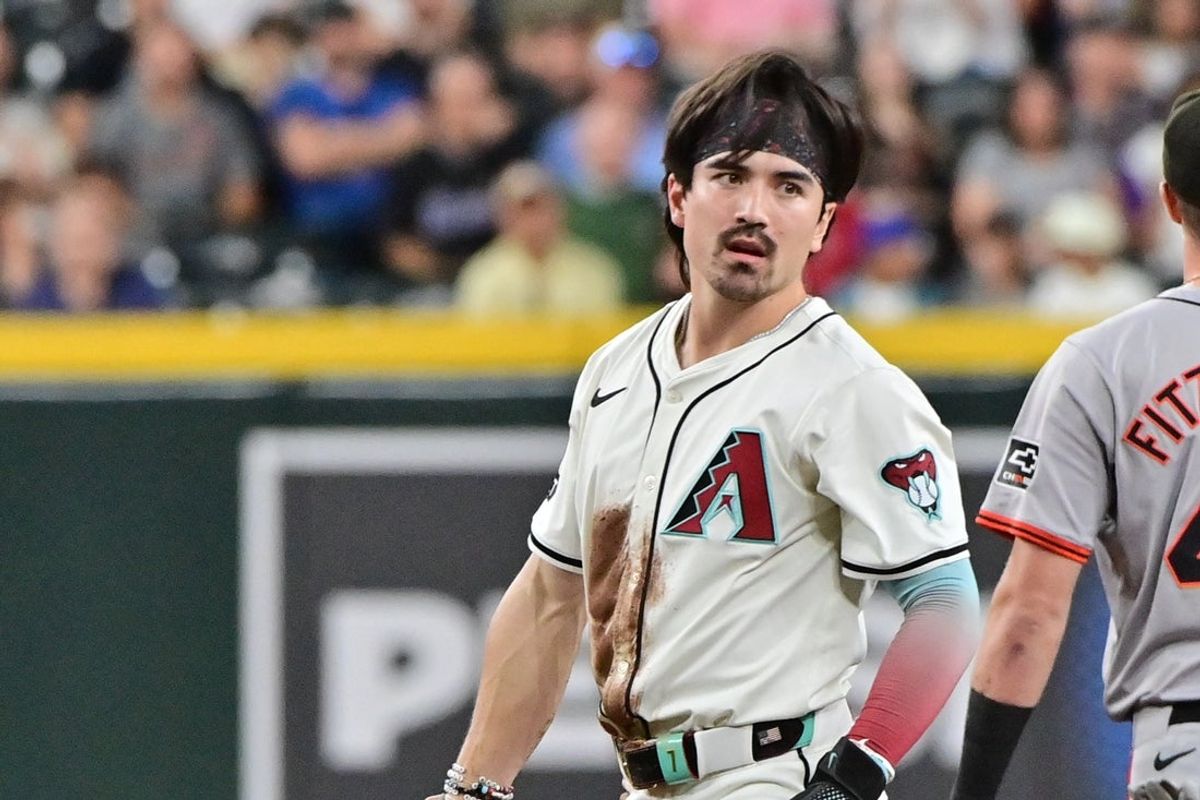 Sep 25, 2024; Phoenix, Arizona, USA; Arizona Diamondbacks outfielder Corbin Carroll (7) reacts after being tagged out stealing second base in the first inning at Chase Field. Mandatory Credit: Matt Kartozian-Imagn Images