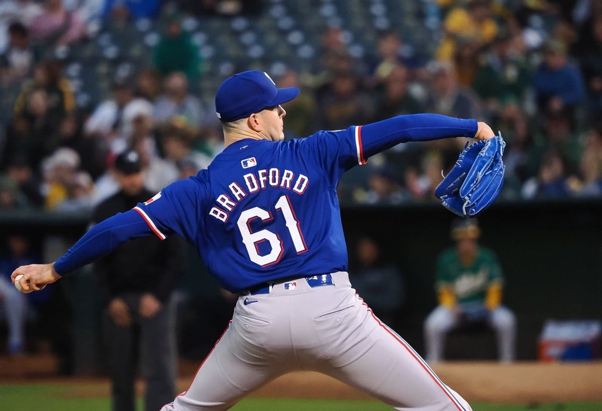 Sep 25, 2024; Oakland, California, USA; Texas Rangers starting pitcher Cody Bradford (61) pitches the ball against the Oakland Athletics during the first inning at Oakland-Alameda County Coliseum. Mandatory Credit: Kelley L Cox-Imagn Images