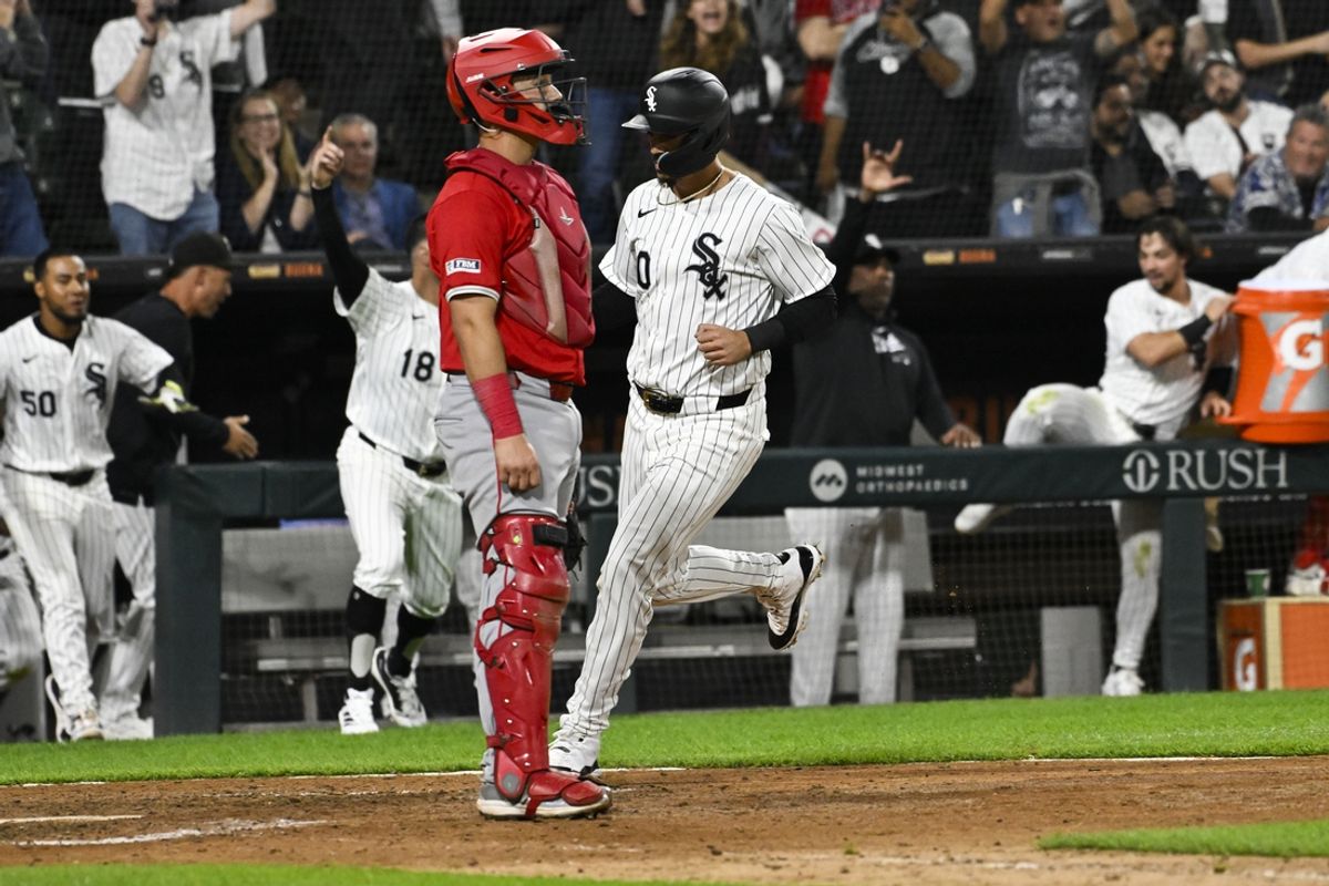 Sep 25, 2024; Chicago, Illinois, USA;  Chicago White Sox outfielder Miguel Vargas (20) scores during the 10th inning against the Los Angeles Angels at Guaranteed Rate Field. Mandatory Credit: Matt Marton-Imagn Images