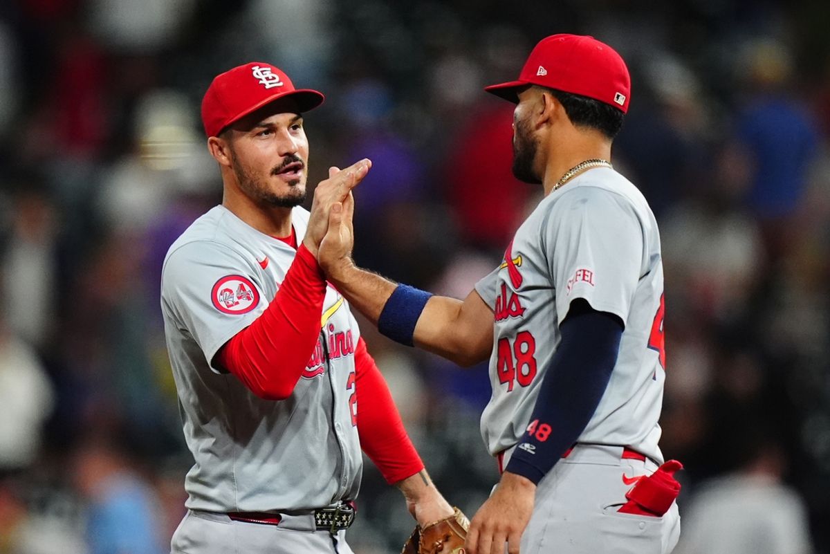 Sep 25, 2024; Denver, Colorado, USA; St. Louis Cardinals third base Nolan Arenado (28) and catcher Ivan Herrera (48) celebrate defeating the Colorado Rockies at Coors Field. Mandatory Credit: Ron Chenoy-Imagn Images