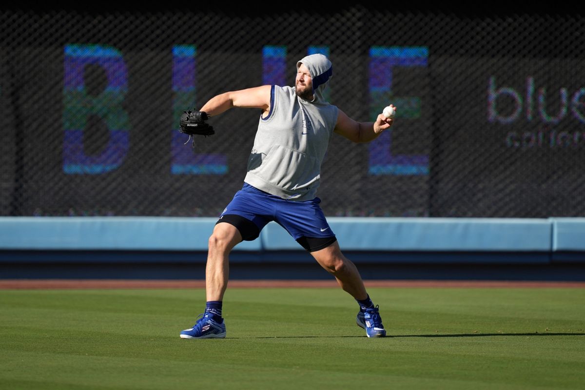 Sep 25, 2024; Los Angeles, California, USA; Los Angeles Dodgers pitcher Clayton Kershaw throws before the game against the San Diego Padres at Dodger Stadium. Mandatory Credit: Kirby Lee-Imagn Images