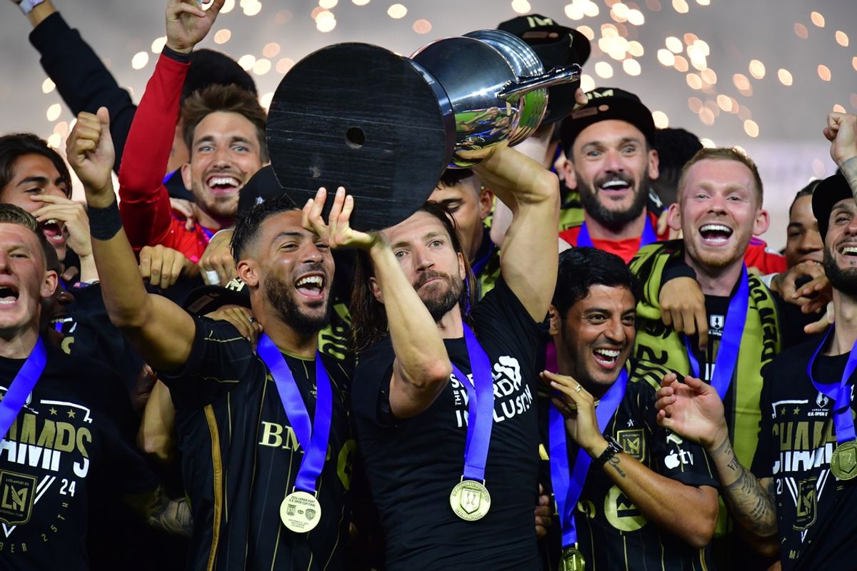 Sep 25, 2024; Los Angeles, California, USA; LAFC forward Denis Bouanga (99) midfielder Ilie Sanchez (6) and Carlos Vela celebrte the championship victory against Sporting Kansas City following the US Open Cup Final at BMO Stadium. Mandatory Credit: Gary A. Vasquez-Imagn Images