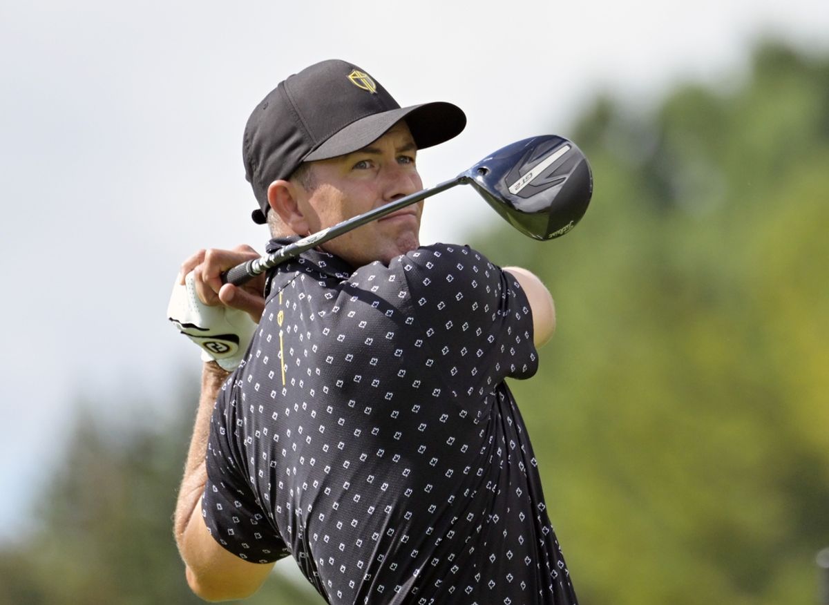 Sep 26, 2024; Ile Bizard, Quebec, CAN; Adam Scott of the International team tees off on the second hole during the first round of The Presidents Cup golf tournament. Mandatory Credit: Eric Bolte-Imagn Images