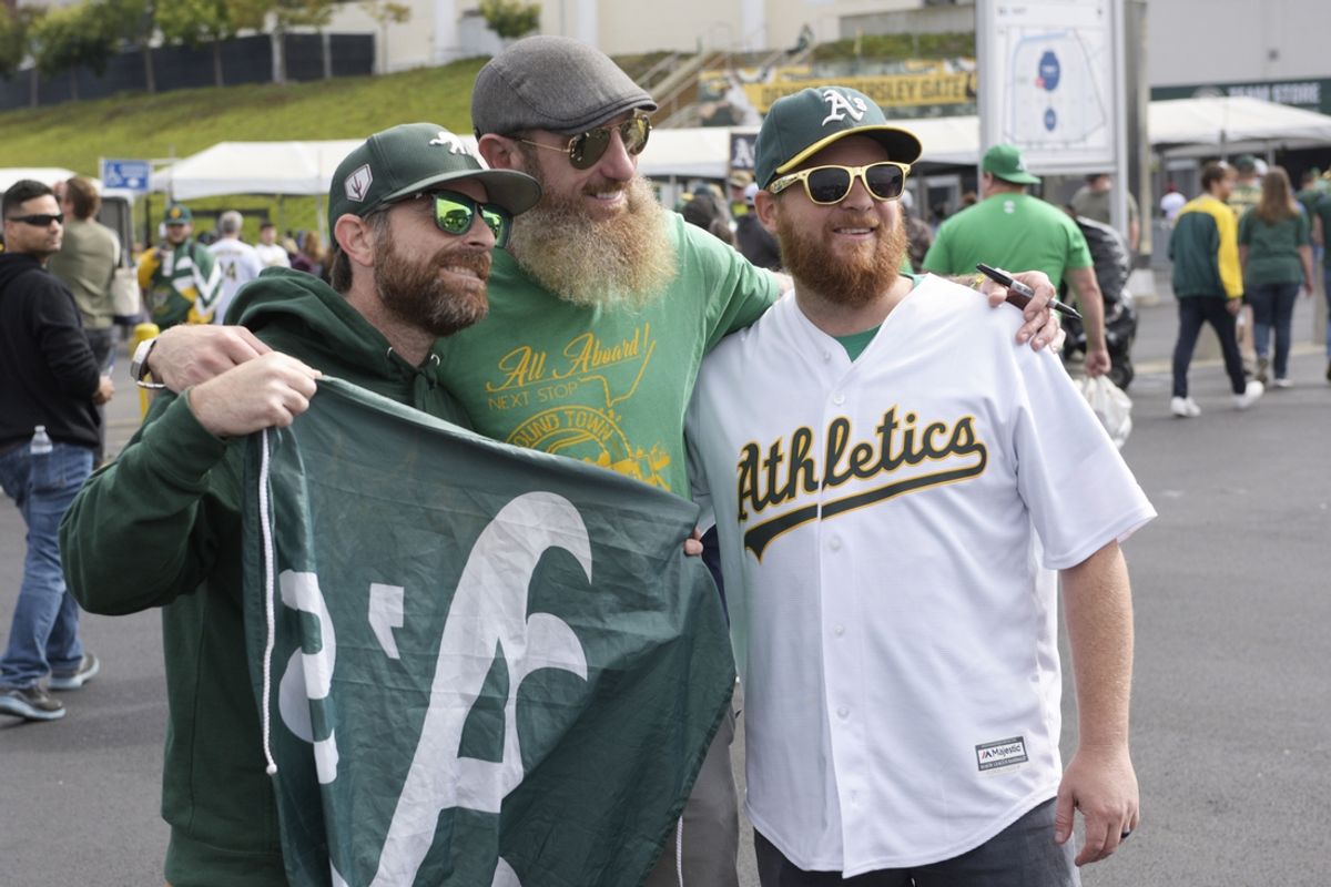 Sep 26, 2024; Oakland, California, USA; Oakland Athletics fans pose for a photo with former Aís pitcher Dallas Braden at Oakland-Alameda County Coliseum. Mandatory Credit: Ed Szczepanski-Imagn Images