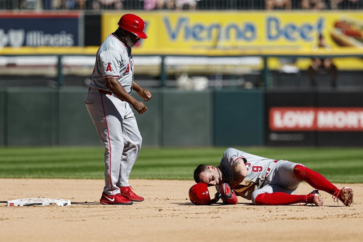 Sep 26, 2024; Chicago, Illinois, USA; Los Angeles Angels shortstop Zach Neto (9) reacts after injuring himself during the fourth inning of a baseball game against the Chicago White Sox at Guaranteed Rate Field. Mandatory Credit: Kamil Krzaczynski-Imagn Images