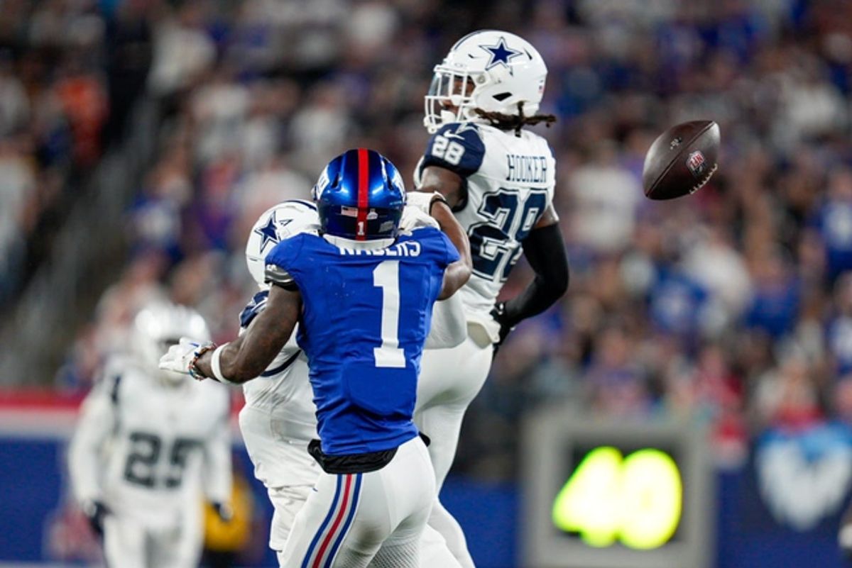 Sep 26, 2024; East Rutherford, NJ, US; New York Giants wide receiver Malik Nabers (1) attempts to catch a pass that was broken up by Dallas Cowboys safety Malik Hooker (28) at MetLife Stadium. Mandatory Credit: Julian Guadalupe-NorthJersey.com