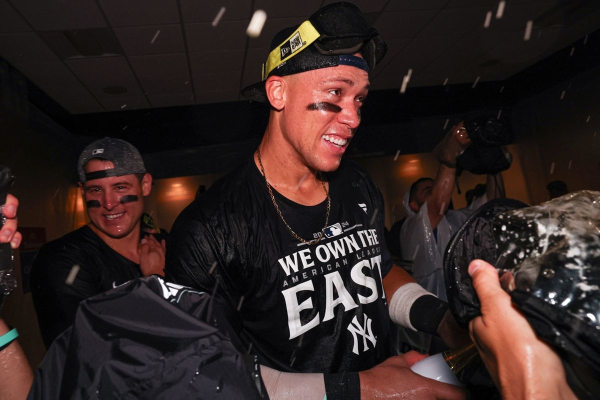Sep 26, 2024; Bronx, New York, USA; New York Yankees center fielder Aaron Judge (99) celebrates after defeating the Baltimore Orioles to clinch the American League East title at Yankee Stadium. Mandatory Credit: Vincent Carchietta-Imagn Images