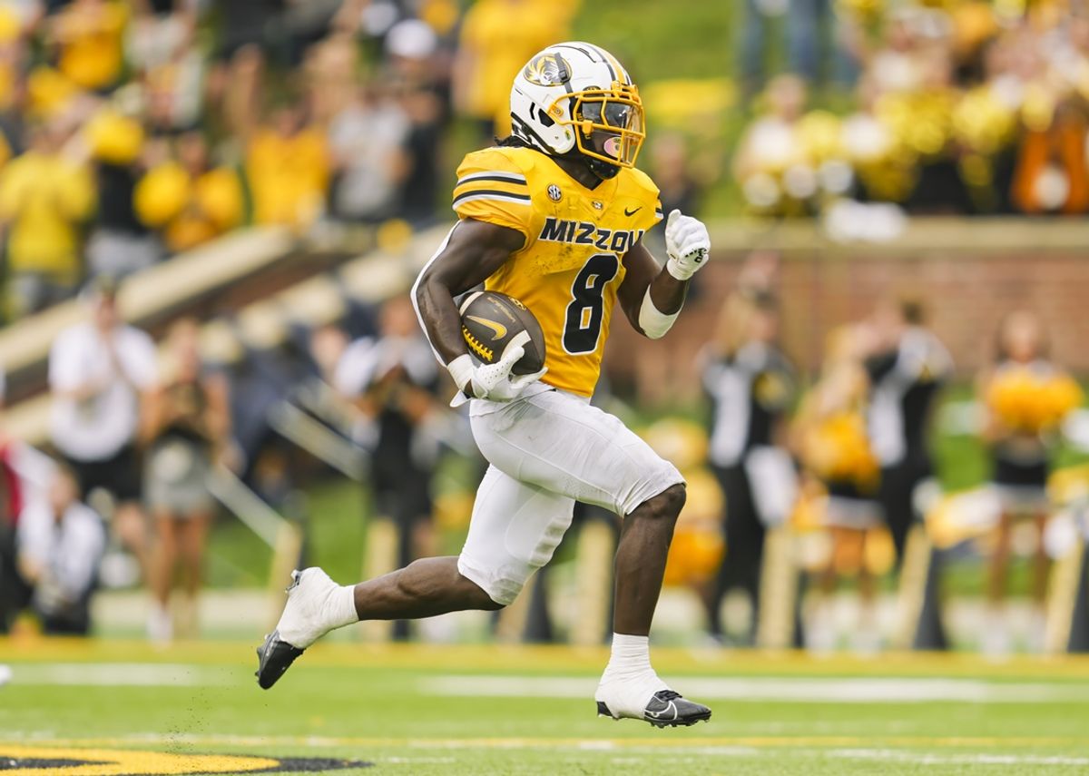 Sep 21, 2024; Columbia, Missouri, USA; Missouri Tigers running back Nate Noel (8) runs the ball during the second half against the Vanderbilt Commodores at Faurot Field at Memorial Stadium. Mandatory Credit: Jay Biggerstaff-Imagn Images