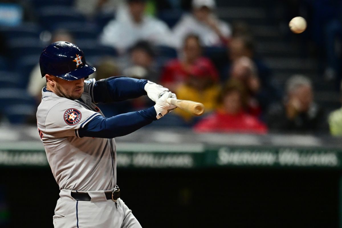 Sep 27, 2024; Cleveland, Ohio, USA; Houston Astros third baseman Alex Bregman (2) hits a sacrifice fly during the first inning against the Cleveland Guardians at Progressive Field. Mandatory Credit: Ken Blaze-Imagn Images