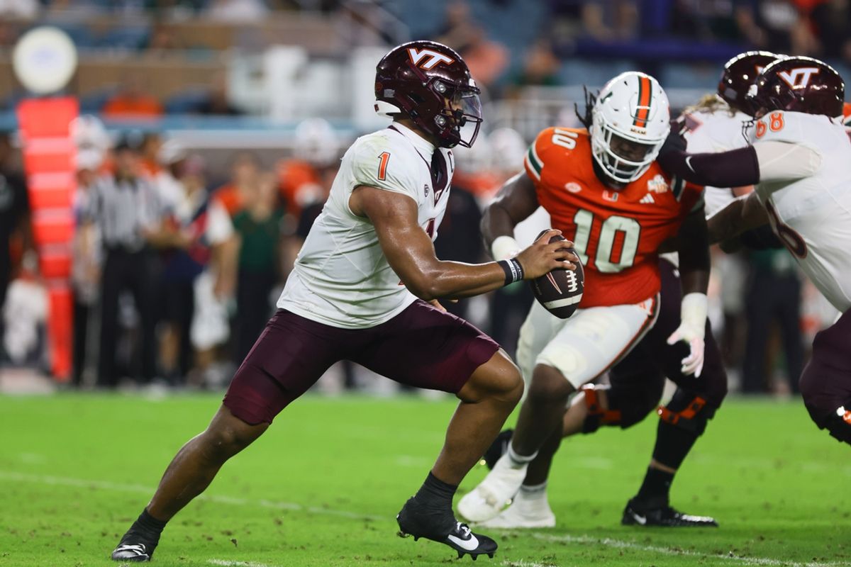 Sep 27, 2024; Miami Gardens, Florida, USA; Virginia Tech Hokies quarterback Kyron Drones (1) runs with the football against the Miami Hurricanes during the second quarter at Hard Rock Stadium. Mandatory Credit: Sam Navarro-Imagn Images