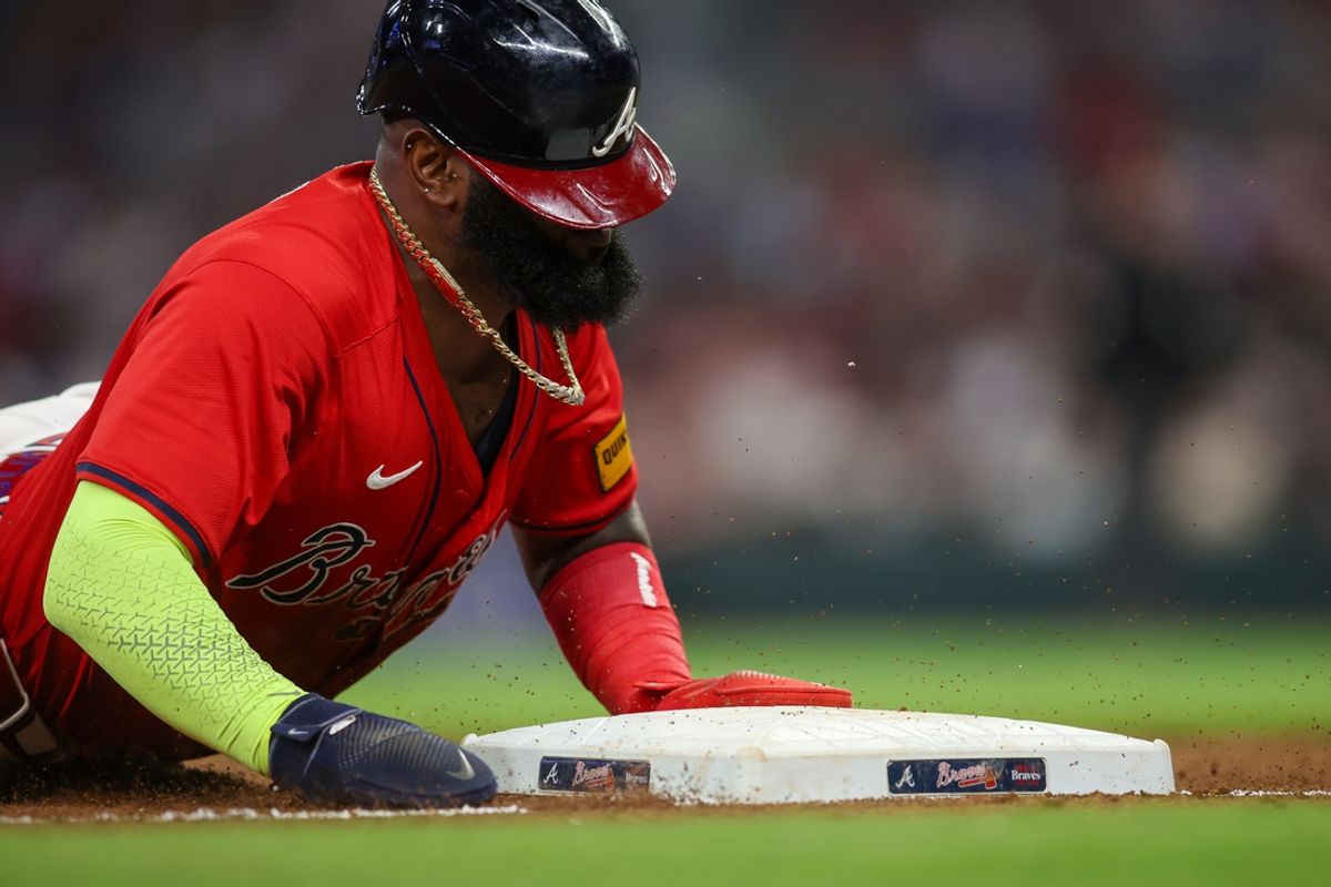 Sep 27, 2024; Atlanta, Georgia, USA; Atlanta Braves designated hitter Marcell Ozuna (20) slides safely into third with a stolen base against the Kansas City Royals in the eighth inning at Truist Park. Mandatory Credit: Brett Davis-Imagn Images