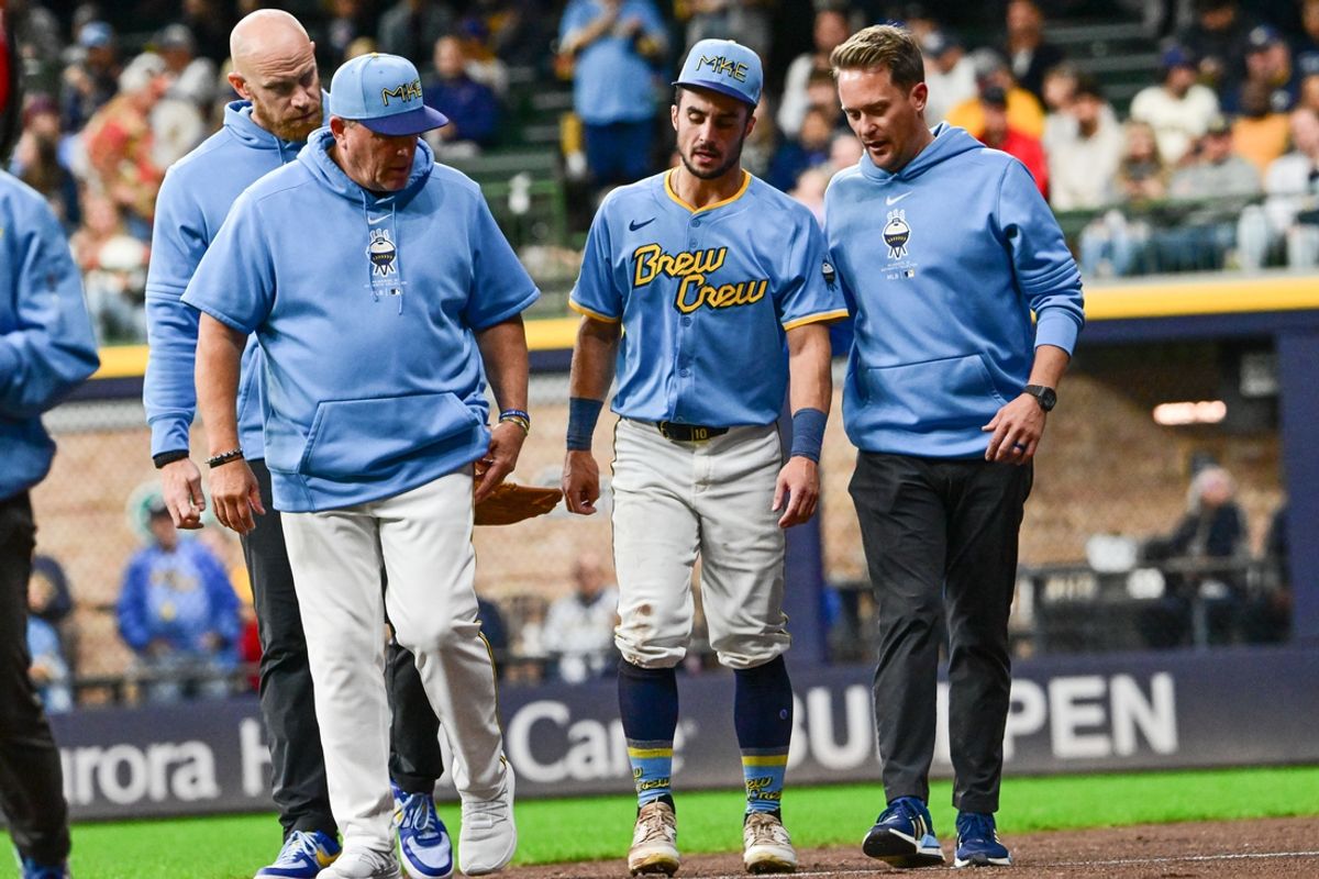 Sep 27, 2024; Milwaukee, Wisconsin, USA; Milwaukee Brewers right fielder Sal Frelick (10) walks off the field with an apparent injury after attempting to make a catch in the third inning against the New York Mets at American Family Field. Mandatory Credit: Benny Sieu-Imagn Images