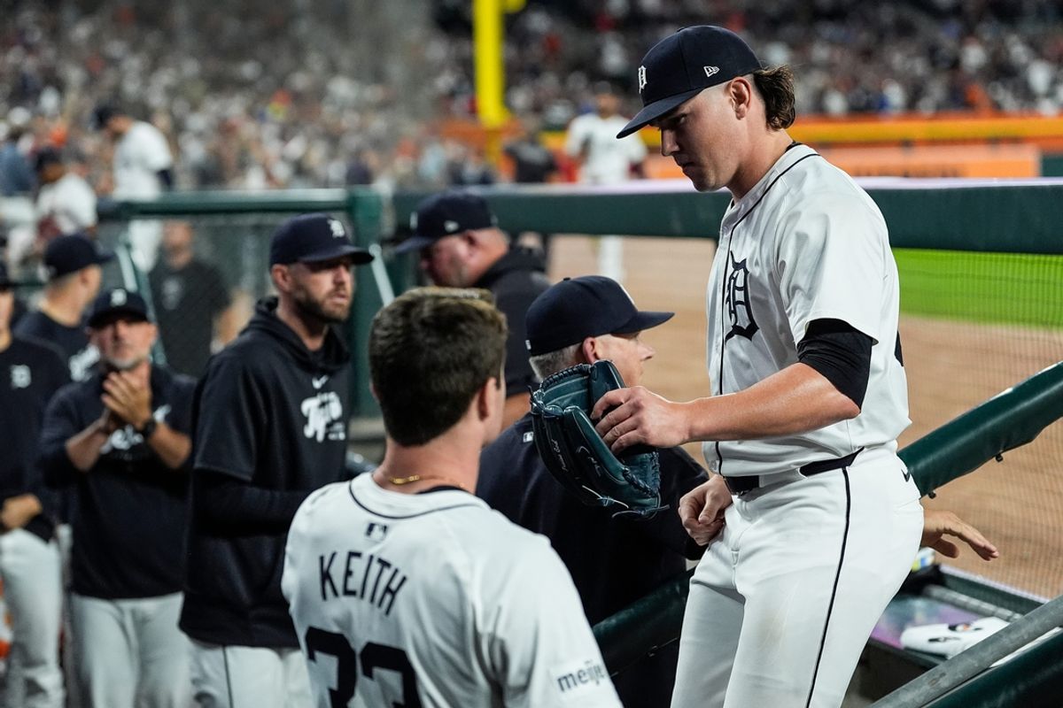Detroit Tigers pitcher Tyler Holton (87) high-fives teammates in the dugout after pitching change against Chicago White Sox during the eighth inning at Comerica Park in Detroit on Friday, Sept. 27, 2024.