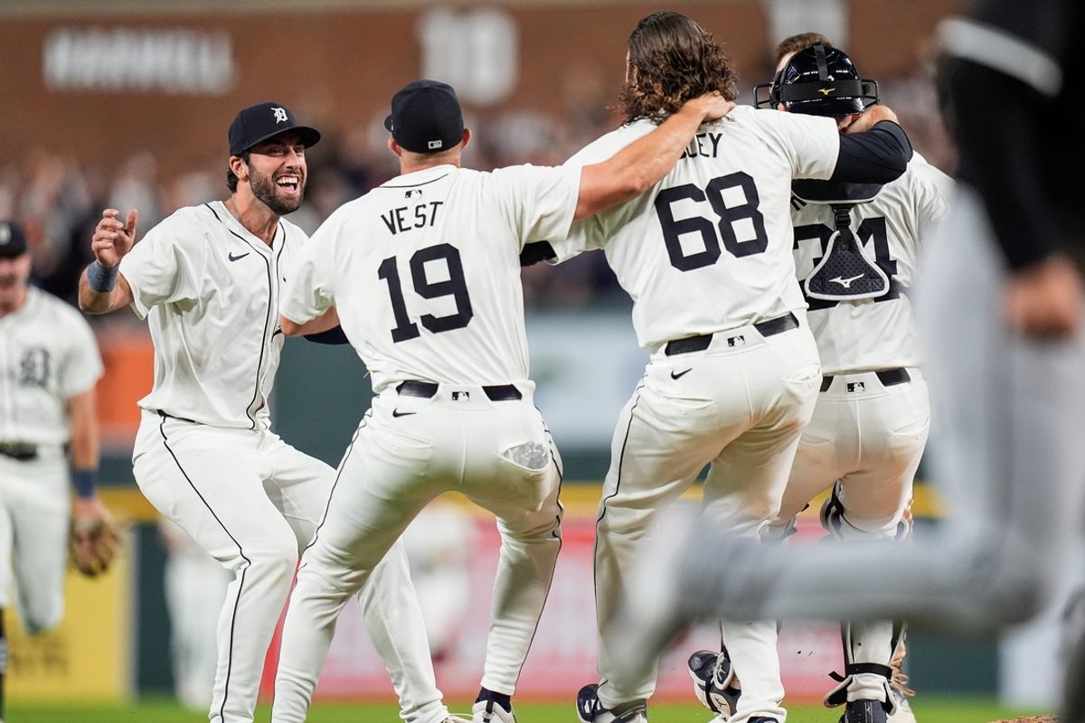 Detroit Tigers third base Matt Vierling (8), left, celebrates with teammates after 4-1 win over Chicago White Sox to clinch a wild card spot in the MLB playoff at Comerica Park in Detroit on Friday, Sept. 27, 2024.
