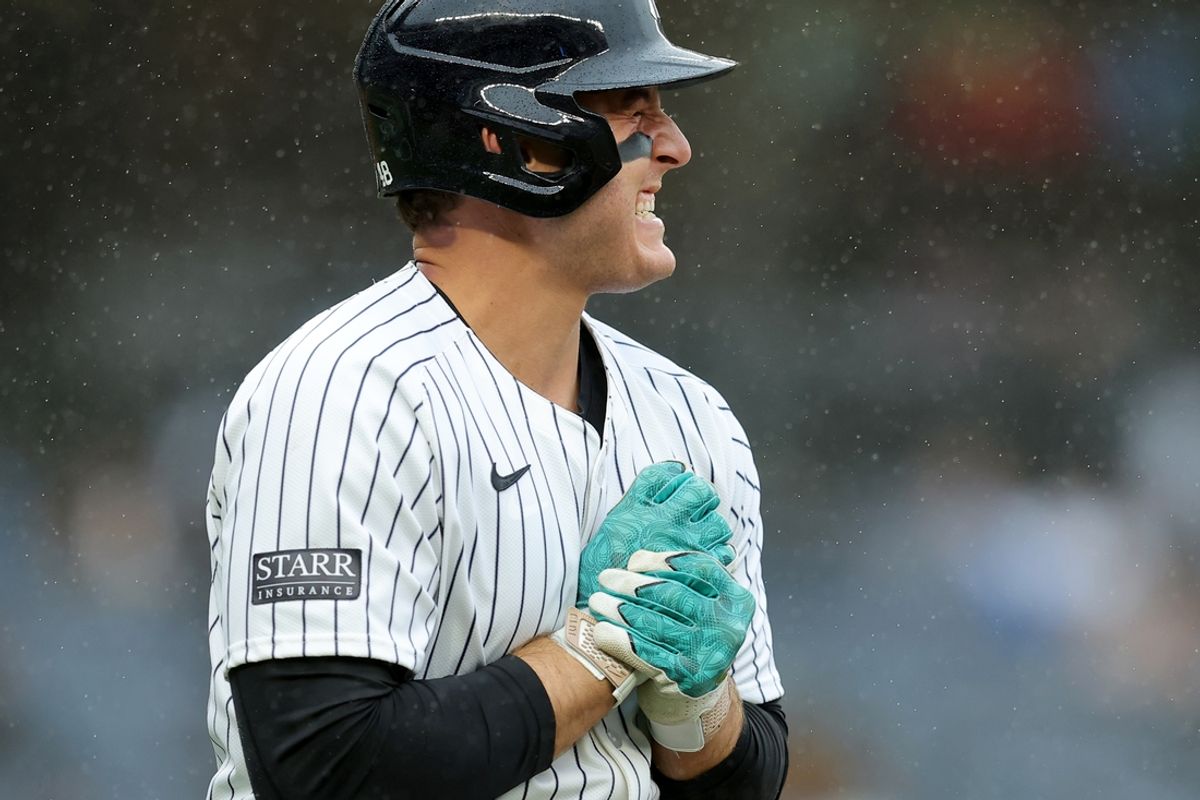 Sep 28, 2024; Bronx, New York, USA; New York Yankees first baseman Anthony Rizzo (48) reacts after being hit by a pitch during the seventh inning against the Pittsburgh Pirates at Yankee Stadium. Mandatory Credit: Brad Penner-Imagn Images