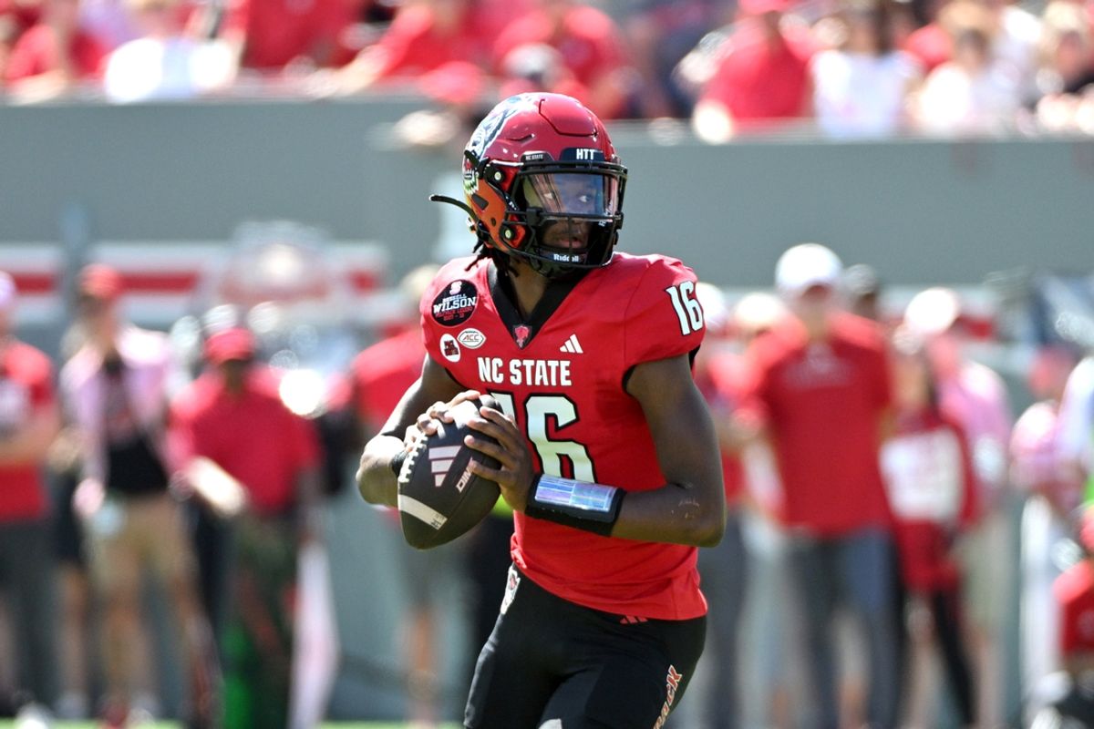 Sep 28, 2024; Raleigh, North Carolina, USA;  North Carolina State Wolfpack quarterback CJ Bailey (16) looks for an opening for a throw against the Northern Illinois Huskies at Carter-Finley Stadium. Mandatory Credit: Zachary Taft-Imagn Images