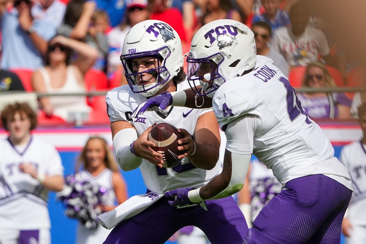 Sep 28, 2024; Kansas City, Missouri, USA; TCU Horned Frogs quarterback Josh Hoover (10) hands off to running back Cam Cook (4) against the Kansas Jayhawks during the first half at GEHA Field at Arrowhead Stadium. Mandatory Credit: Denny Medley-Imagn Images