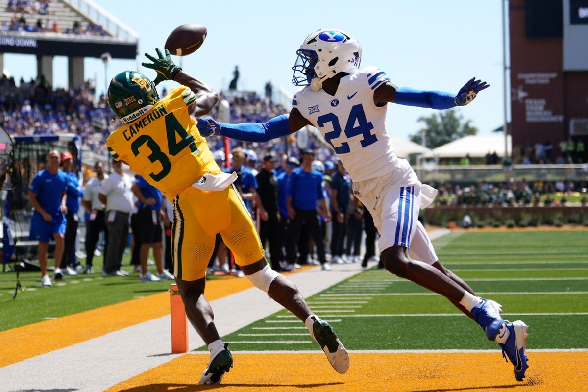 Sep 28, 2024; Waco, Texas, USA;  Baylor Bears wide receiver Josh Cameron (34) makes a touchdown catch against Brigham Young Cougars cornerback Therrian Alexander III (24) during the second half at McLane Stadium. Mandatory Credit: Chris Jones-Imagn Images