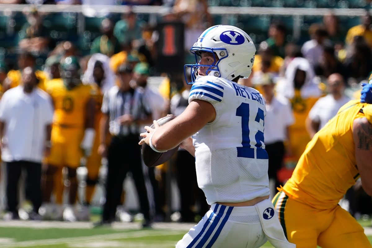 Sep 28, 2024; Waco, Texas, USA;  Brigham Young Cougars quarterback Jake Retzlaff (12) looks to pass against the Baylor Bears during the second half at McLane Stadium. Mandatory Credit: Chris Jones-Imagn Images