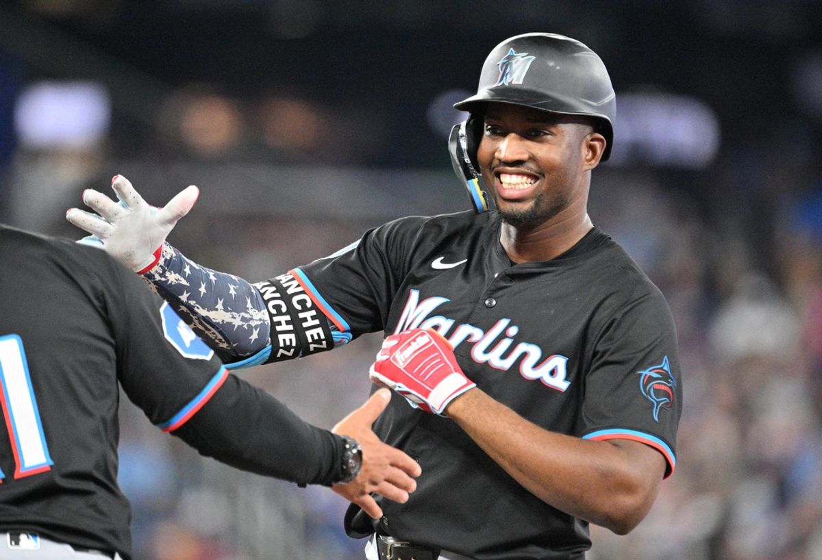Sep 28, 2024; Toronto, Ontario, CAN;   Miami Marlins right fielder Jesus Sanchez (12) celebrates after hitting a single against the Toronto Blue Jays in the eighth inning at Rogers Centre. Mandatory Credit: Dan Hamilton-Imagn Images