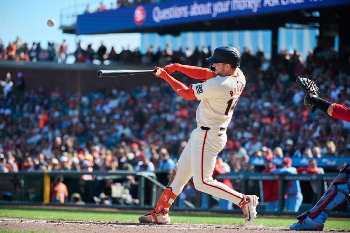 Sep 28, 2024; San Francisco, California, USA; San Francisco Giants catcher Patrick Bailey (14) hits an RBI sacrifice fly against the St. Louis Cardinals during the sixth inning at Oracle Park. Mandatory Credit: Robert Edwards-Imagn Images