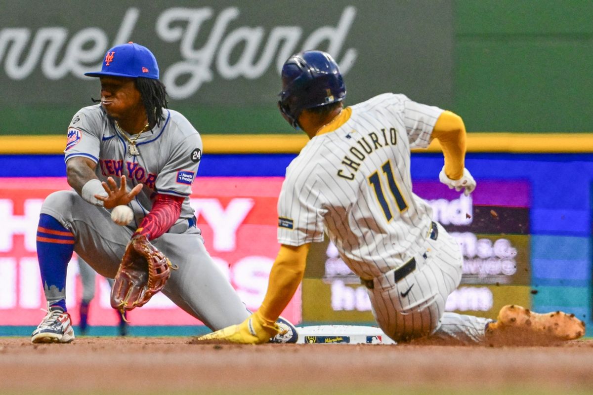 Sep 28, 2024; Milwaukee, Wisconsin, USA; Milwaukee Brewers right fielder Jackson Chourio (11) steals second base as New York Mets shortstop Luisangel Acuna (2) gets the ball in the first inning at American Family Field. Mandatory Credit: Benny Sieu-Imagn Images