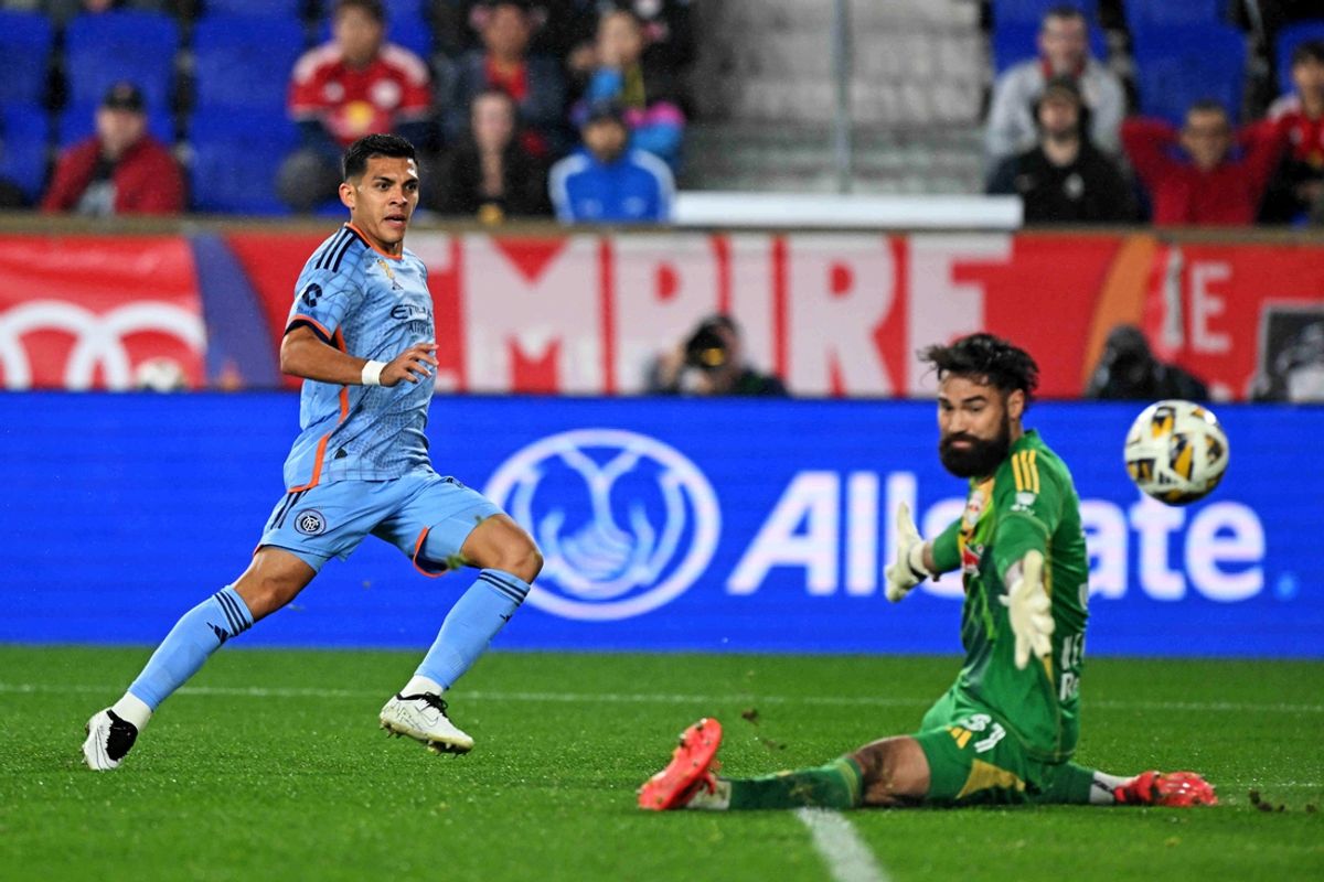 Sep 28, 2024; Harrison, New Jersey, USA; New York City FC forward Alonso Martinez (16) scores a goal against New York Red Bulls goalkeeper Carlos Coronel (31) during the first half at Red Bull Arena. Mandatory Credit: Dennis Schneidler-Imagn Images