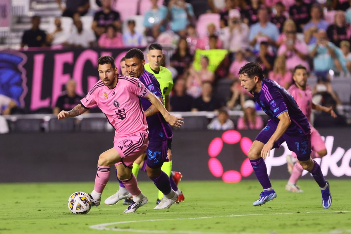 Sep 28, 2024; Fort Lauderdale, Florida, USA; Inter Miami CF forward Lionel Messi (10) plays the ball defended day Charlotte FC midfielder Junior Urso (30) in the first half at Chase Stadium. Mandatory Credit: Sam Navarro-Imagn Images