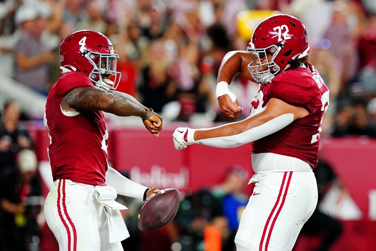 Sep 28, 2024; Tuscaloosa, Alabama, USA; Alabama Crimson Tide quarterback Jalen Milroe (4) celebrates with offensive lineman Parker Brailsford (72) after scoring a touchdown during the first quarter against the Georgia Bulldogs at Bryant-Denny Stadium. Mandatory Credit: John David Mercer-Imagn Images